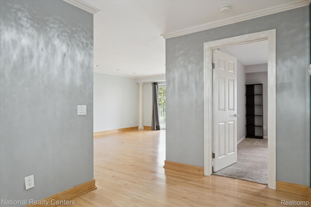 3559 Port Cove Dr Unit 17, Waterford, MI 48328 - empty room with a smoke detector, wood finished floors, and crown molding