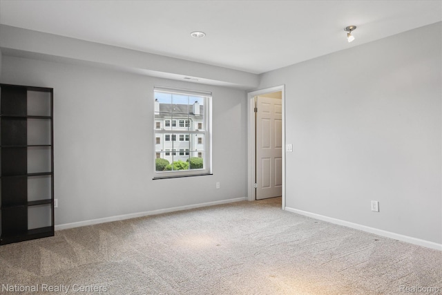 3559 Port Cove Dr Unit 17, Waterford, MI 48328 - carpeted empty room featuring baseboards