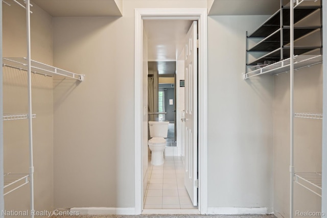3559 Port Cove Dr Unit 17, Waterford, MI 48328 - walk in closet with tile patterned flooring