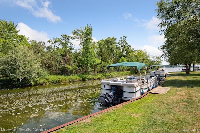 3559 Port Cove Dr Unit 17, Waterford, MI 48328 - dock area with a water view and a yard
