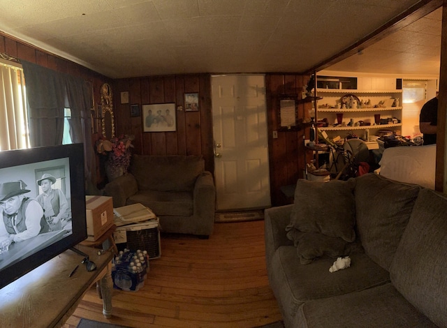2062 Hatch Ave, Benton Harbor, MI 49022 - living room featuring wood-type flooring and wood walls