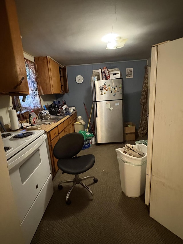 2062 Hatch Ave, Benton Harbor, MI 49022 - kitchen featuring white appliances, brown cabinetry, dark carpet, and light countertops