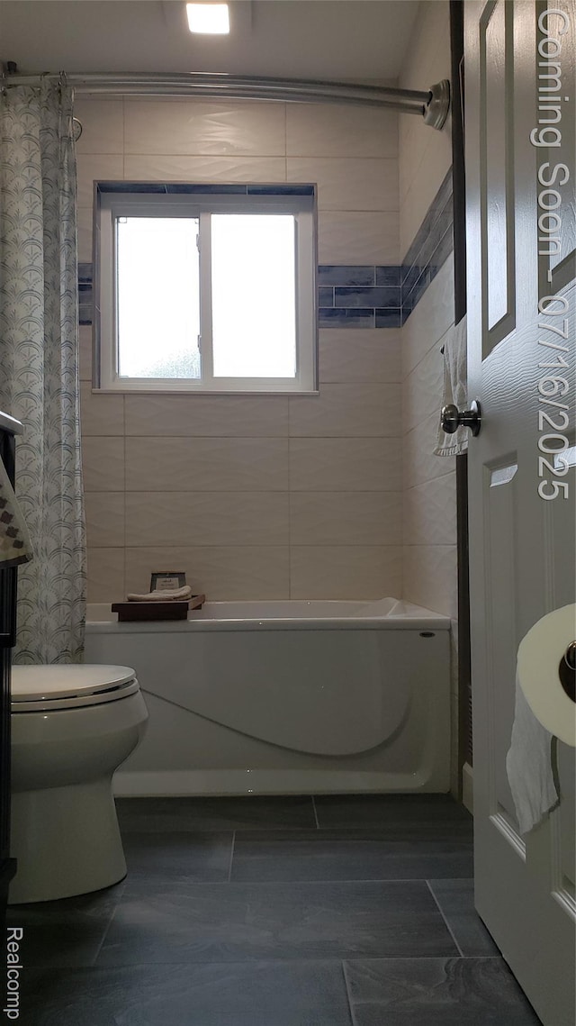 27315 Gilbert Dr, Warren, MI 48093 - bathroom with shower / bath combo with shower curtain, plenty of natural light, and tile walls