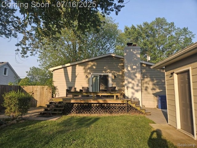27315 Gilbert Dr, Warren, MI 48093 - back of house featuring a chimney and a deck