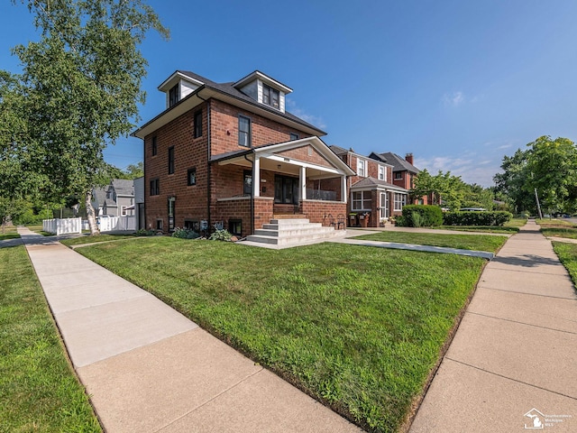 525 Godfroy Ave, Monroe, MI 48162 - view of front of home featuring brick siding and covered porch