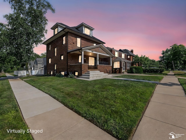 525 Godfroy Ave, Monroe, MI 48162 - traditional style home featuring covered porch, brick siding, and a lawn
