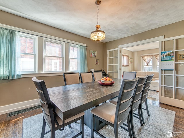 525 Godfroy Ave, Monroe, MI 48162 - dining area with wood finished floors and a chandelier