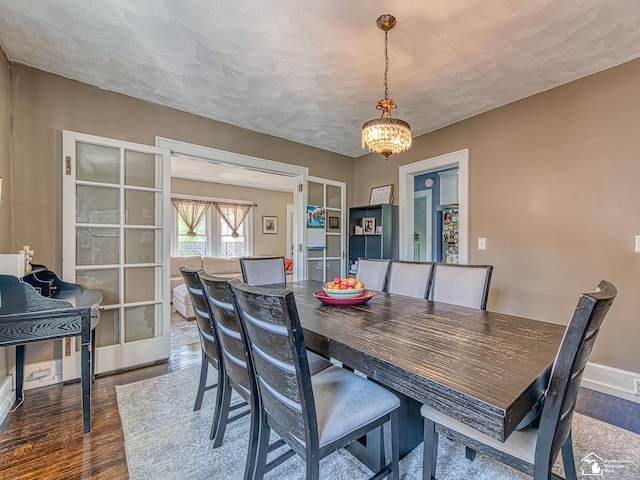 525 Godfroy Ave, Monroe, MI 48162 - dining space featuring wood finished floors, french doors, and a chandelier