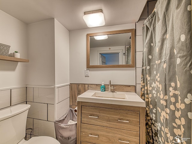 525 Godfroy Ave, Monroe, MI 48162 - full bathroom featuring vanity, a wainscoted wall, and tile walls