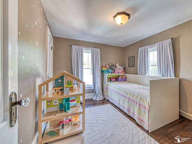 525 Godfroy Ave, Monroe, MI 48162 - bedroom featuring multiple windows and wood finished floors