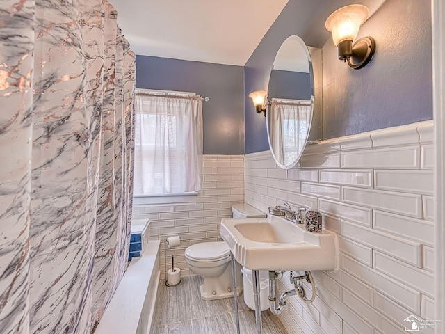 525 Godfroy Ave, Monroe, MI 48162 - bathroom with tile walls and a wainscoted wall
