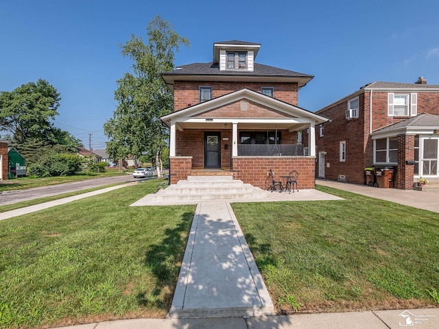 525 Godfroy Ave, Monroe, MI 48162 - traditional style home featuring a front lawn, covered porch, and brick siding