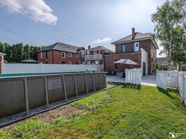 525 Godfroy Ave, Monroe, MI 48162 - fenced backyard with a patio