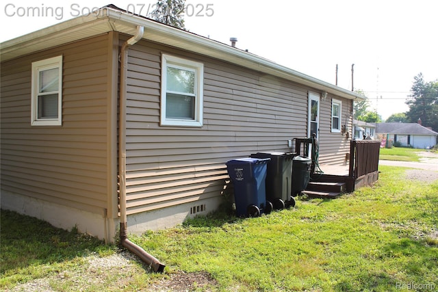 1030 Meida St, Flint, MI 48532 - view of side of property featuring a yard and crawl space