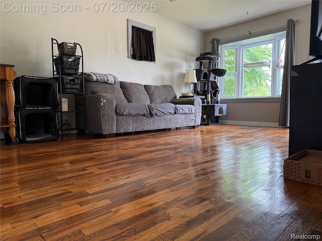 1030 Meida St, Flint, MI 48532 - living area with wood-type flooring and baseboards