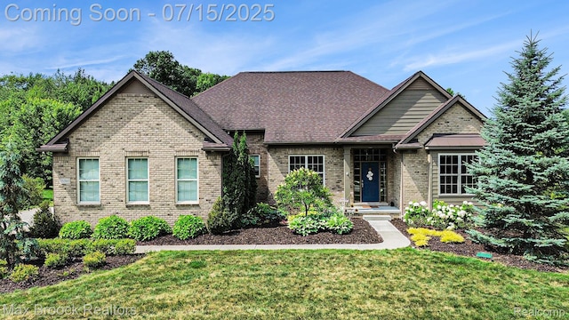 23395 Stoneleigh Ct, South Lyon, MI 48178 - view of front of home with brick siding and a front lawn