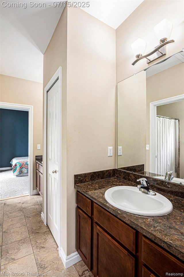 23395 Stoneleigh Ct, South Lyon, MI 48178 - bathroom featuring vanity and connected bathroom