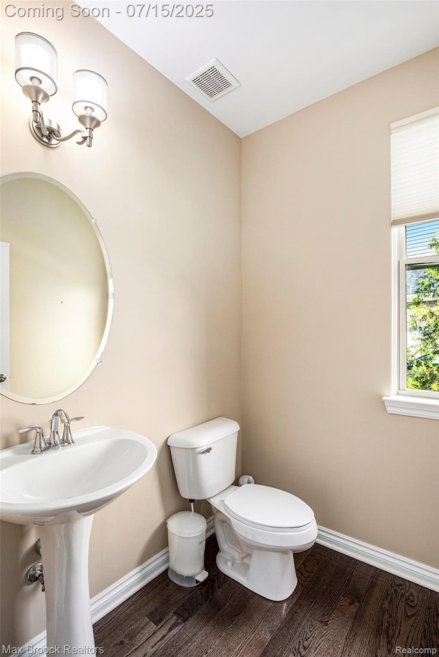 23395 Stoneleigh Ct, South Lyon, MI 48178 - bathroom featuring wood finished floors and toilet