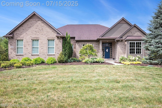 23395 Stoneleigh Ct, South Lyon, MI 48178 - ranch-style house featuring brick siding and a front yard