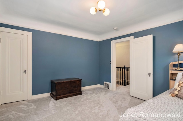 1055 San Lucia Dr SE, Grand Rapids, MI 49506 - carpeted bedroom with crown molding and a chandelier