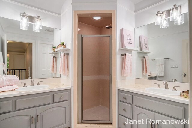 1055 San Lucia Dr SE, Grand Rapids, MI 49506 - bathroom with two vanities, a shower stall, and crown molding