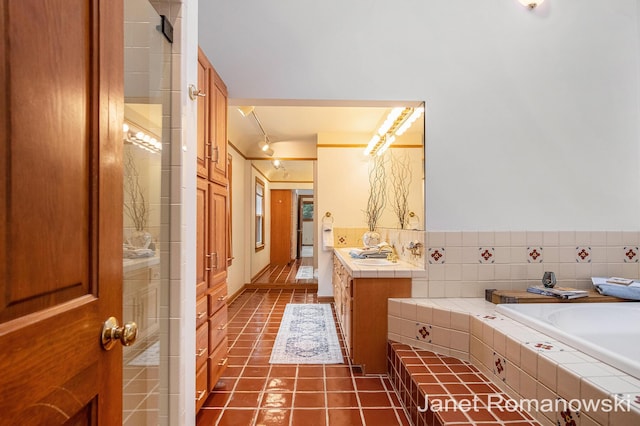 1055 San Lucia Dr SE, Grand Rapids, MI 49506 - full bath featuring tile patterned flooring, vanity, and a bath