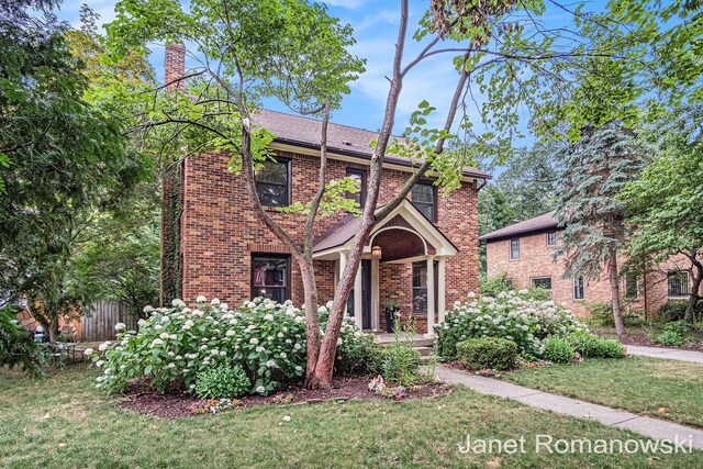 1055 San Lucia Dr SE, Grand Rapids, MI 49506 - view of front of home featuring brick siding and a chimney