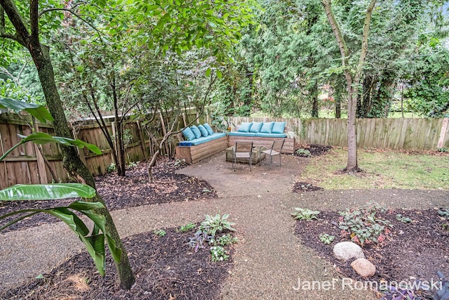 1055 San Lucia Dr SE, Grand Rapids, MI 49506 - fenced backyard featuring an outdoor living space and a patio