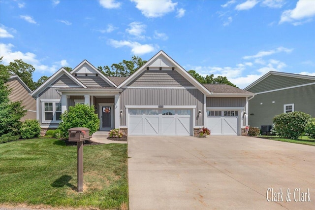 4454 Keena Ct NE Unit 71, Grand Rapids, MI 49525 - craftsman inspired home with board and batten siding, an attached garage, a front lawn, and driveway