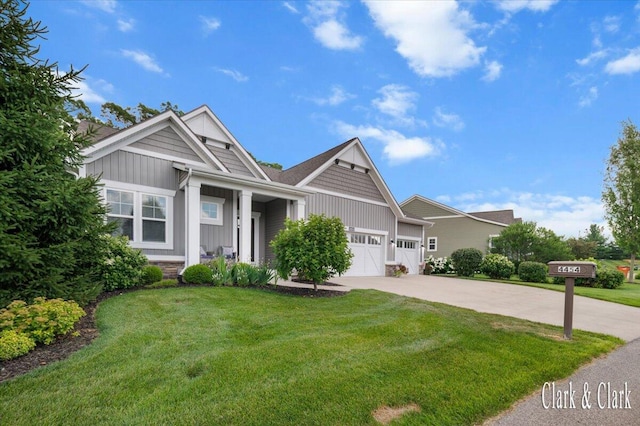 4454 Keena Ct NE Unit 71, Grand Rapids, MI 49525 - craftsman-style house with board and batten siding, driveway, a garage, and a front lawn