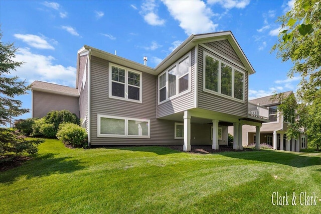 4454 Keena Ct NE Unit 71, Grand Rapids, MI 49525 - rear view of house with a lawn