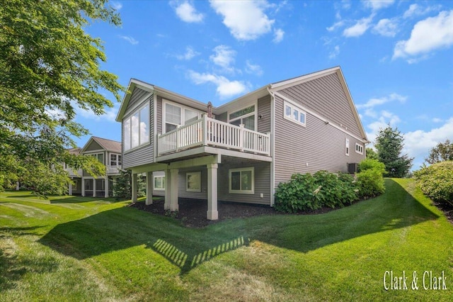 4454 Keena Ct NE Unit 71, Grand Rapids, MI 49525 - rear view of property with a lawn and a wooden deck