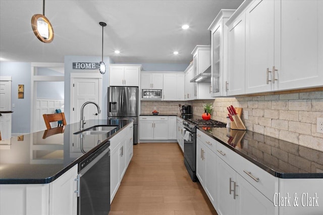 4454 Keena Ct NE Unit 71, Grand Rapids, MI 49525 - kitchen featuring stainless steel appliances, dark countertops, white cabinets, and recessed lighting