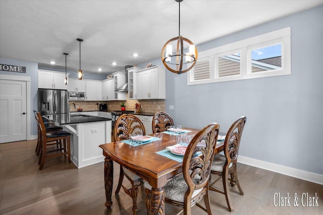 4454 Keena Ct NE Unit 71, Grand Rapids, MI 49525 - dining room featuring a chandelier, wood finished floors, and recessed lighting