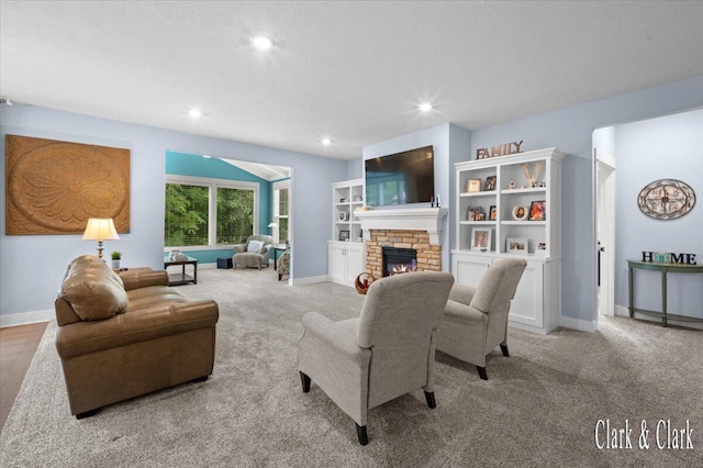 4454 Keena Ct NE Unit 71, Grand Rapids, MI 49525 - living room featuring carpet floors, a brick fireplace, recessed lighting, and a textured ceiling