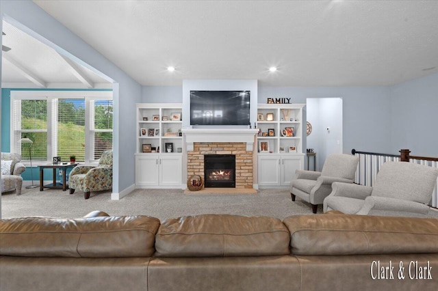 4454 Keena Ct NE Unit 71, Grand Rapids, MI 49525 - carpeted living room with a glass covered fireplace and baseboards