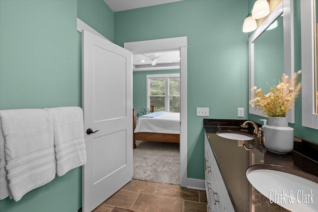 4454 Keena Ct NE Unit 71, Grand Rapids, MI 49525 - ensuite bathroom with double vanity and stone finish flooring