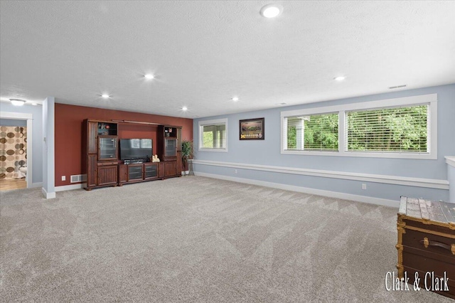 4454 Keena Ct NE Unit 71, Grand Rapids, MI 49525 - unfurnished living room with light carpet, a textured ceiling, and recessed lighting