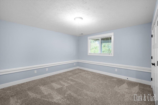 4454 Keena Ct NE Unit 71, Grand Rapids, MI 49525 - spare room featuring carpet and a textured ceiling