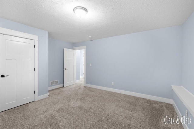4454 Keena Ct NE Unit 71, Grand Rapids, MI 49525 - unfurnished bedroom with carpet floors and a textured ceiling