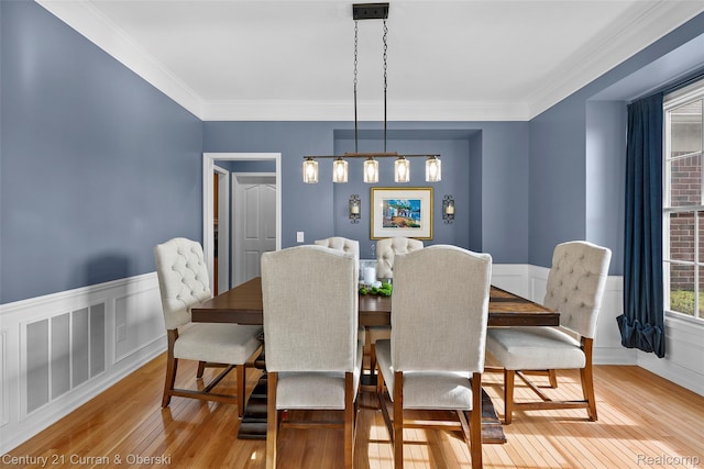 1760 Bedlington Ct, Rochester Hills, MI 48307 - dining area featuring light wood finished floors, a wainscoted wall, and crown molding