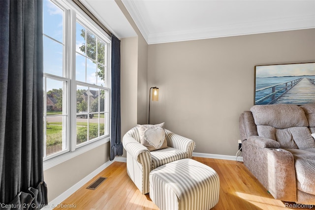 1760 Bedlington Ct, Rochester Hills, MI 48307 - sitting room featuring ornamental molding, light wood-style floors, and healthy amount of natural light