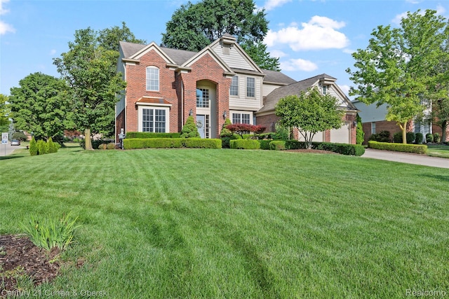 1760 Bedlington Ct, Rochester Hills, MI 48307 - view of front of property with brick siding, a front lawn, and concrete driveway