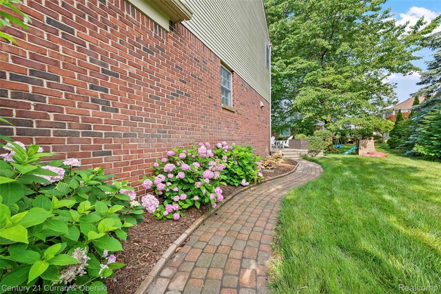 1760 Bedlington Ct, Rochester Hills, MI 48307 - view of home's exterior with a yard and brick siding