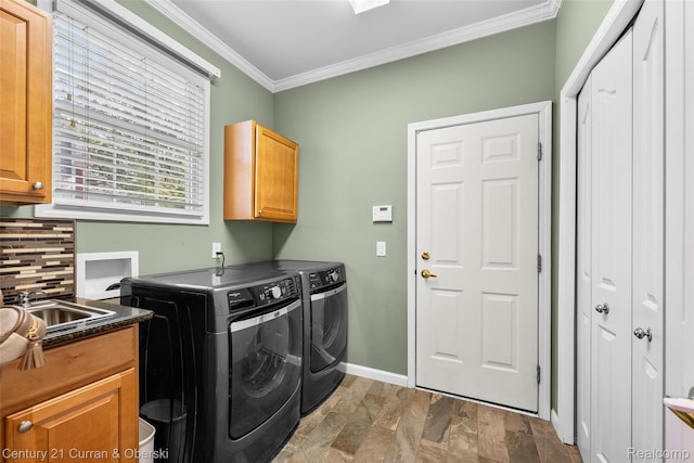 1760 Bedlington Ct, Rochester Hills, MI 48307 - washroom featuring independent washer and dryer, cabinet space, crown molding, and stone finish floors