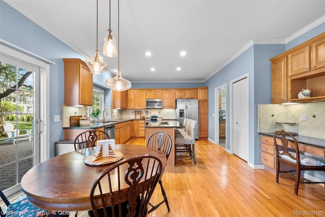 1760 Bedlington Ct, Rochester Hills, MI 48307 - dining space featuring light wood-type flooring, recessed lighting, ornamental molding, and healthy amount of natural light