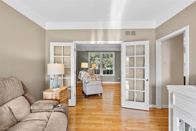 1760 Bedlington Ct, Rochester Hills, MI 48307 - living room with crown molding, light wood-style flooring, and french doors