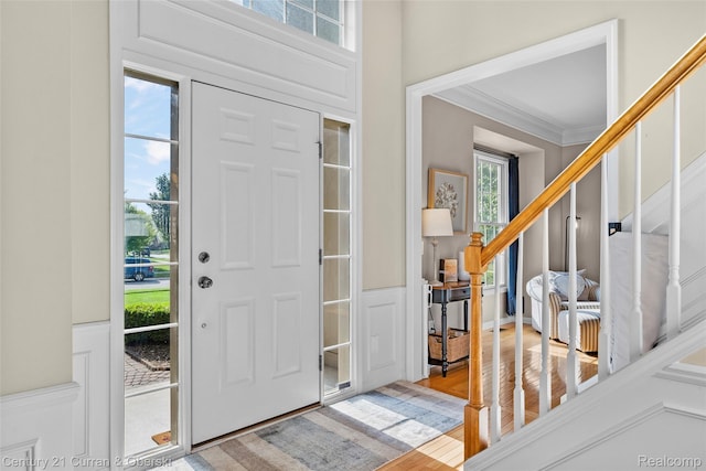 1760 Bedlington Ct, Rochester Hills, MI 48307 - entrance foyer with wood finished floors, wainscoting, and crown molding