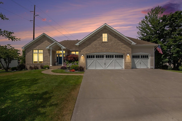 172 Bay Meadows Dr, Holland, MI 49424 - view of front of property featuring brick siding, concrete driveway, a yard, and an attached garage