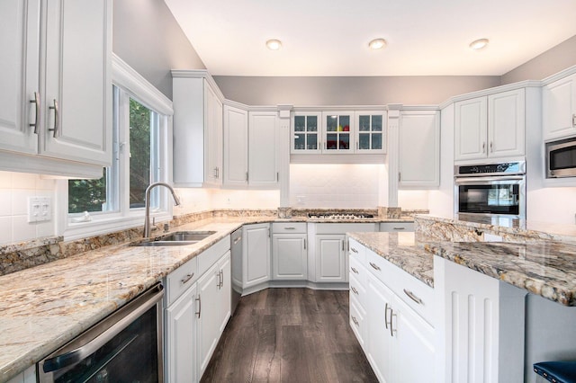 172 Bay Meadows Dr, Holland, MI 49424 - kitchen with stainless steel appliances, white cabinetry, dark wood-style flooring, light stone countertops, and recessed lighting